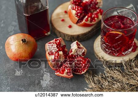 Stock Photo - Pomegranates with glass of juice. Fotosearch