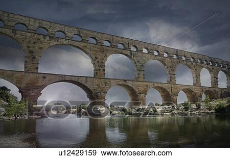 Stock Photo - Pont du Gard at night in Vers-Pont-du-Gard, France. Fotosearch