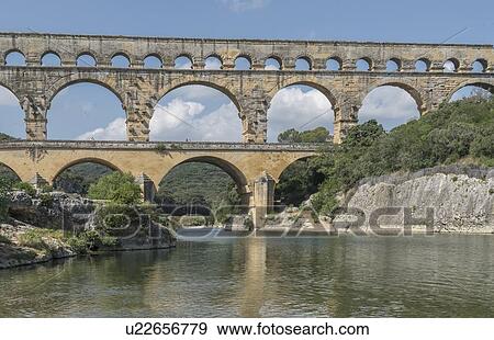 Stock Photo - Pont du Gard over Gardon River in Vers-Pont-du-Gard, France. Fotosearch