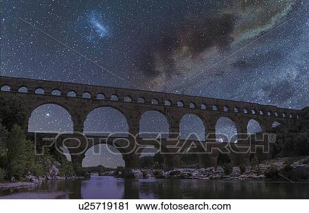 Pont du Gard under starscape at night in Vers-Pont-du-Gard, France View Large Photo Image Stock Image - Pont du Gard under starscape at night in Vers-Pont-du-Gard, France. Fotosearch