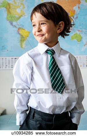 Portrait of boy in school uniform, World map in background View Large Photo Image Stock Photography - Portrait of boy in school uniform, World map in background. Fotosearch