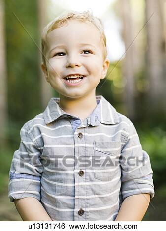 Portrait of boy wearing striped shirt View Large Photo Image Stock Photograph - Portrait of boy wearing striped shirt. Fotosearch