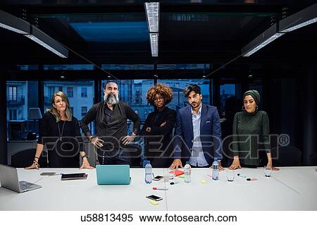 Stock Photography - Portrait of confident business partners in office. Fotosearch