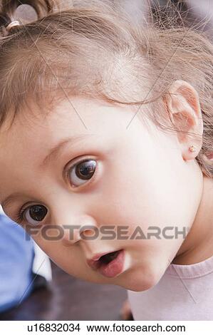 Picture - Portrait of curious girl. Fotosearch