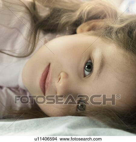 Picture - Portrait of girl lying down. Fotosearch