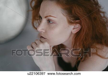 Stock Photo - Portrait of redhead young woman. Fotosearch