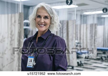 Stock Image - Portrait of smiling doctor with stethoscope. Fotosearch
