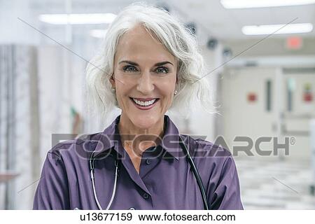 Stock Photo - Portrait of smiling doctor with stethoscope. Fotosearch