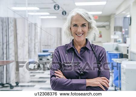 Stock Photograph - Portrait of smiling doctor with stethoscope. Fotosearch