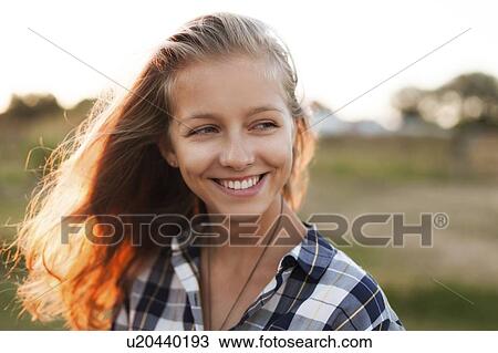 Portrait of smiling young woman View Large Photo Image Stock Image - Portrait of smiling young woman. Fotosearch