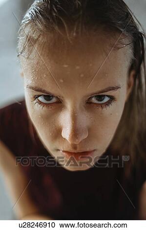 Stock Image - Portrait of wet young woman. Fotosearch