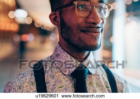 Stock Image - Portrait of young businessman. Fotosearch