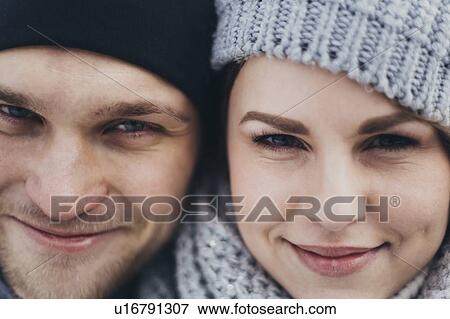 Portrait of young couple wearing woolly hats View Large Photo Image Stock Photo - Portrait of young couple wearing woolly hats. Fotosearch