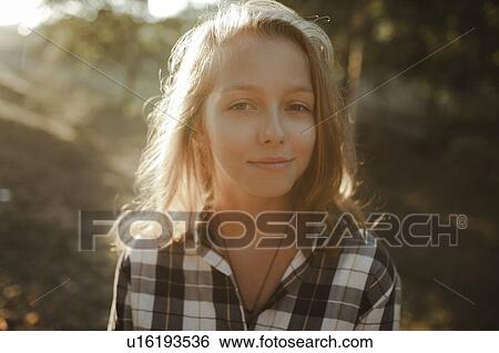 Portrait of young woman in sunlight View Large Photo Image Stock Photograph - Portrait of young woman in sunlight. Fotosearch