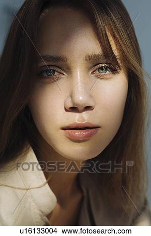 Picture - Portrait of young woman wearing natural make-up. Fotosearch