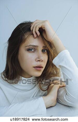 Picture - Portrait of young woman wearing natural make-up. Fotosearch