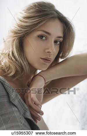Portrait of young woman wearing natural make-up View Large Photo Image Stock Photo - Portrait of young woman wearing natural make-up. Fotosearch