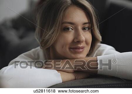 Stock Photo - Portrait of young woman wearing natural make-up. Fotosearch