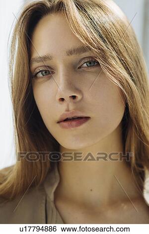 Stock Photograph - Portrait of young woman wearing natural make-up. Fotosearch