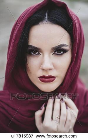 Portrait of young woman wearing red lipstick and headscarf View Large Photo Image Stock Photo - Portrait of young woman wearing red lipstick and headscarf. Fotosearch