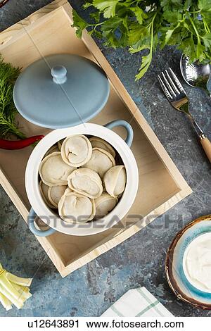 Pot of dumplings on tray View Large Photo Image Stock Image - Pot of dumplings on tray. Fotosearch