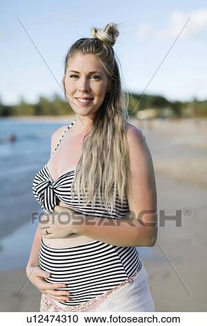 Pregnant woman on beach View Large Photo Image Stock Image - Pregnant woman on beach. Fotosearch