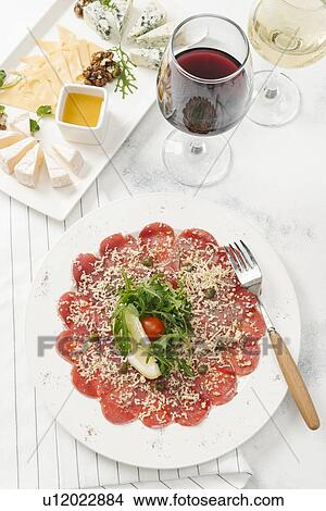 Prosciutto, wine and cheese plate View Large Photo Image Picture - Prosciutto, wine and cheese plate. Fotosearch
