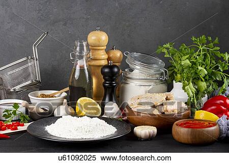 Stock Photography - Raw ingredients including vegetables and flour. Fotosearch