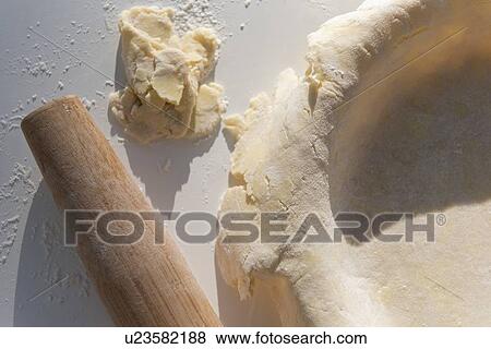 Stock Photo - Raw pie crust with rolling pin. Fotosearch