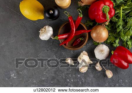 Raw vegetable ingredients with chili peppers View Large Photo Image Stock Image - Raw vegetable ingredients with chili peppers. Fotosearch
