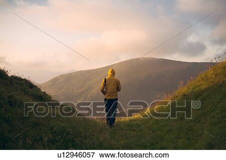 Rear view of man hiking in the Carpathian Mountain Range View Large Photo Image Stock Photo - Rear view of man hiking in the Carpathian Mountain Range. Fotosearch