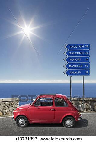 Red car by road sign on Amalfi Coast, Italy View Large Photo Image Stock Image - Red car by road sign on Amalfi Coast, Italy. Fotosearch