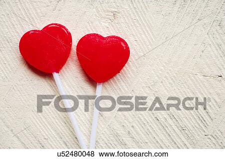 Stock Photo - Red heart shaped lollipops. Fotosearch