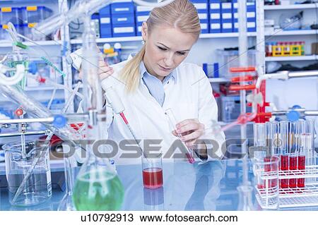 Stock Image - Researcher in chemistry lab.. Fotosearch