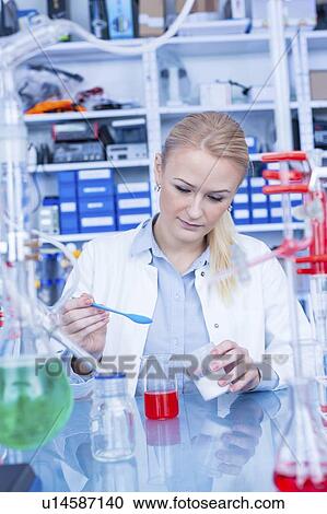 Stock Image - Researcher in chemistry lab.. Fotosearch