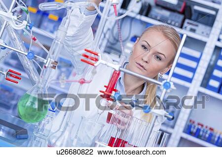 Stock Image - Researcher in chemistry lab.. Fotosearch