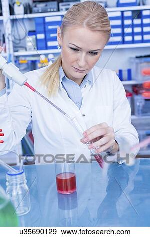 Stock Photo - Researcher in chemistry lab.. Fotosearch