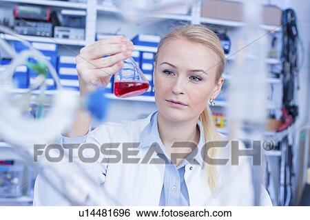 Stock Photograph - Researcher in chemistry lab.. Fotosearch