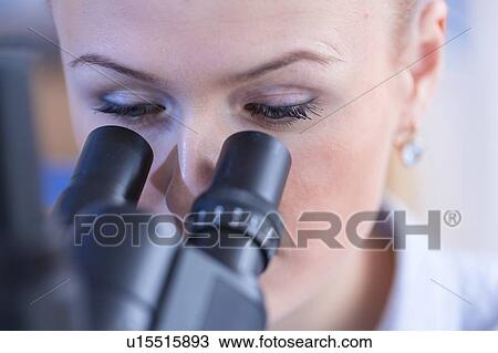 Researcher using microscope. View Large Photo Image Stock Image - Researcher using microscope.. Fotosearch