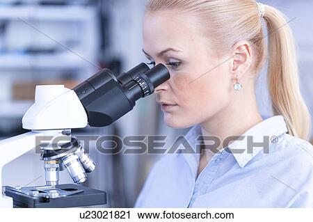 Researcher using microscope. View Large Photo Image Stock Image - Researcher using microscope.. Fotosearch