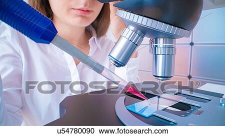 Researcher using microscope. View Large Photo Image Stock Image - Researcher using microscope.. Fotosearch