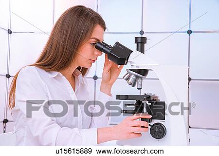 Researcher using microscope. View Large Photo Image Stock Photo - Researcher using microscope.. Fotosearch