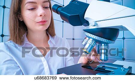 Researcher using microscope. View Large Photo Image Stock Photo - Researcher using microscope.. Fotosearch