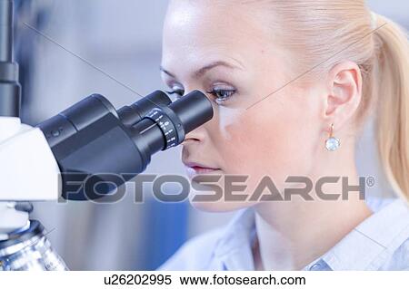 Researcher using microscope. View Large Photo Image Stock Photography - Researcher using microscope.. Fotosearch