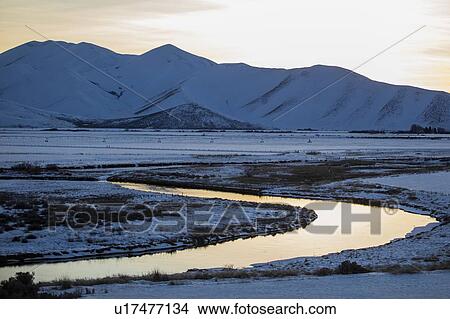 Picture - River and mountains at sunrise in Picabo, Idaho. Fotosearch
