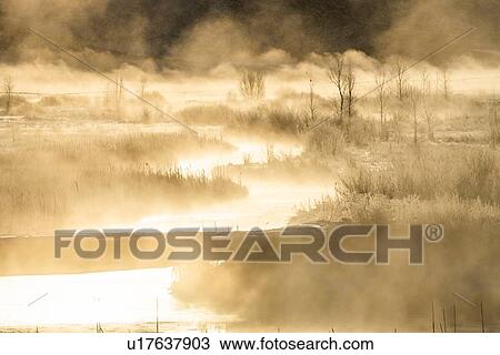 Stock Image - River at sunrise in Picabo, Idaho. Fotosearch
