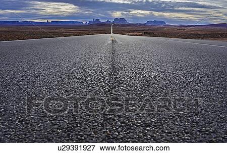 Road through Monument Valley, Utah, USA View Large Photo Image Stock Photo - Road through Monument Valley, Utah, USA. Fotosearch