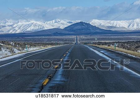 Road to snowcapped mountains in Sun Valley, Idaho, USA View Large Photo Image Stock Photo - Road to snowcapped mountains in Sun Valley, Idaho, USA. Fotosearch