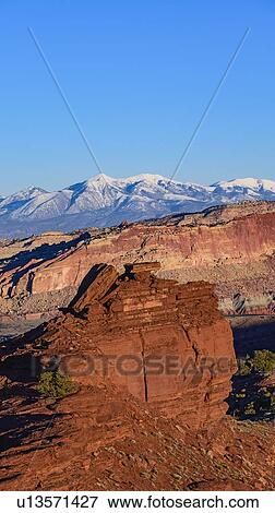 Stock Photo - Rock formations and mountain landscape in Capitol Reef National Park, USA. Fotosearch