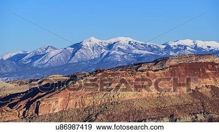 Stock Photo - Rock formations and mountain landscape in Capitol Reef National Park, USA. Fotosearch